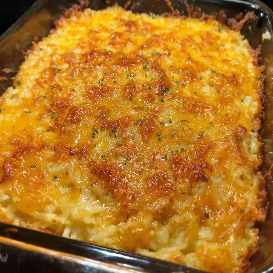 A cheesy, golden casserole cooling in a dish.