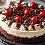 A slice of cake with chocolate and white frosting.