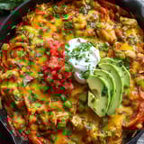 A food dish with a scoop of white topping.