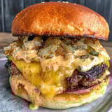 A burger with cheese and onions.