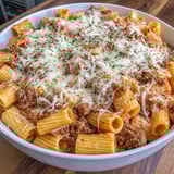 A bowl packed with cheesy pasta and beefy bites.
