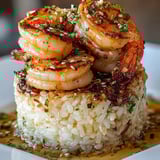 Shrimp and rice on a serving plate.