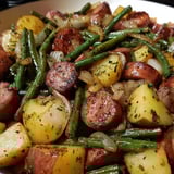 A bowl loaded with sausage, potatoes, and green beans.